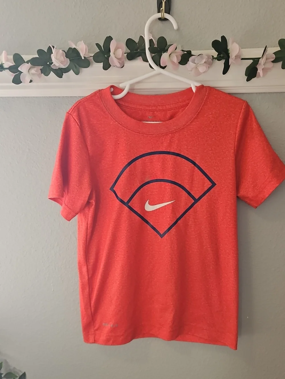 Nike Kids Orange Tee with Navy Graphic and White Swoosh